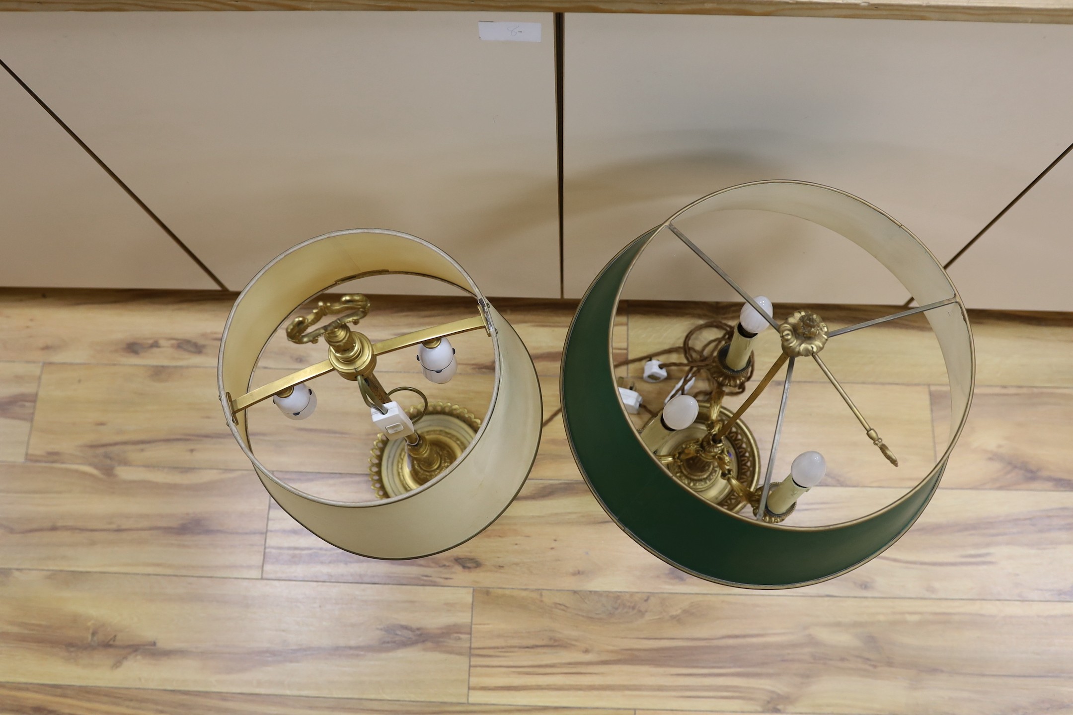 Two large French bouillotte style ornate gilt metal table lamps, tallest 70cm
